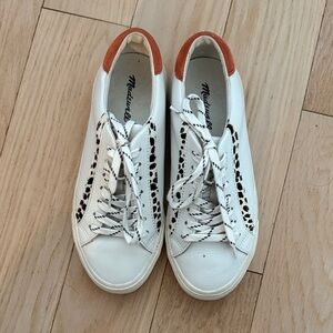 White and Black Sneakers with Orange Accents